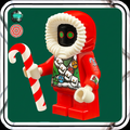 Toy figure in a red outfit with a candy cane on a green background