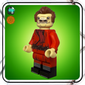 LEGO figure in red outfit on a green background
