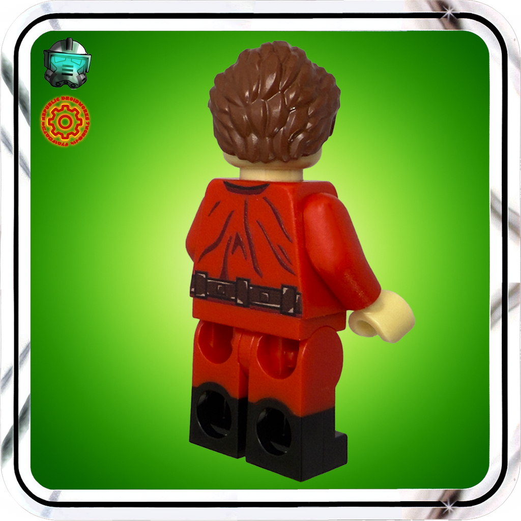 LEGO figure with red outfit and brown hair on a green background
